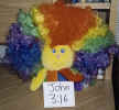 Ranbow Hector in a rainbow wig, with a sign that reads "John 3:16." (160985 bytes)