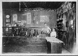 Picture of the inside of the Jerz family shoe shop, Chicago, c1920.